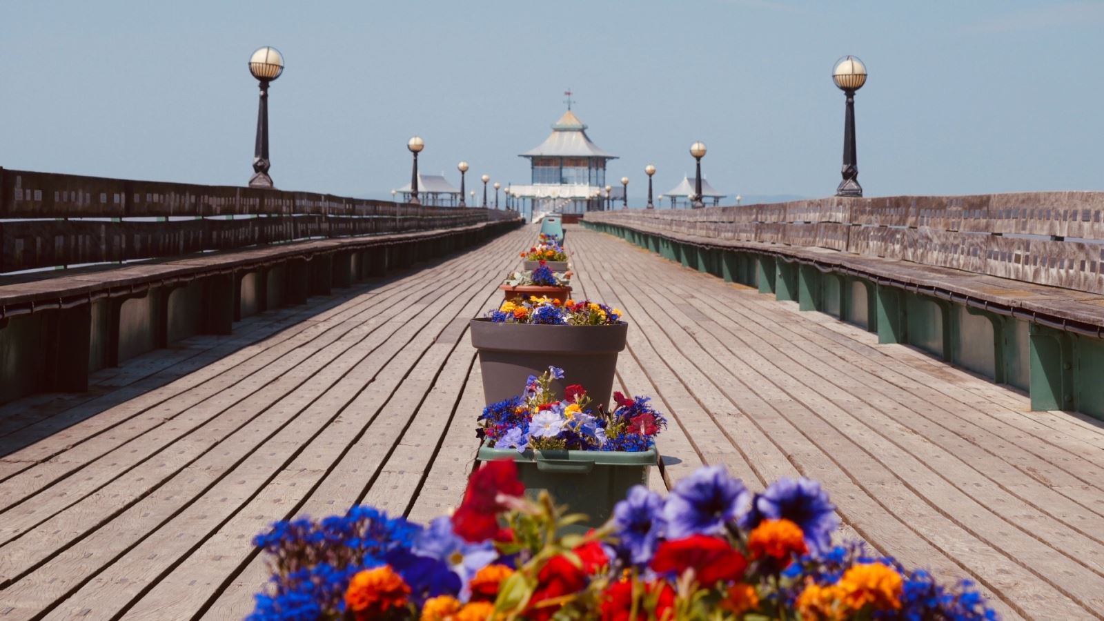 Flowers line the centre of Clevedon Pier